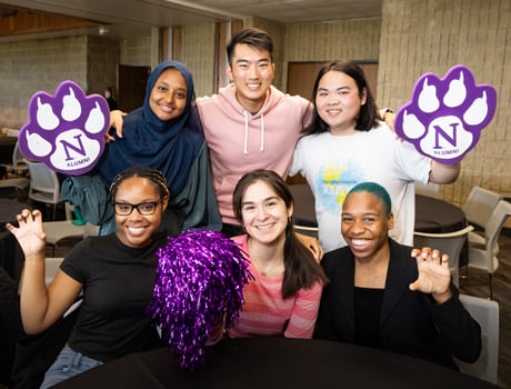 Six Wildcats holds up their hands in claws