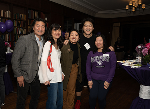 NU-A5 members smiling at an event