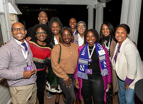 NUBAA alums smiling at an event