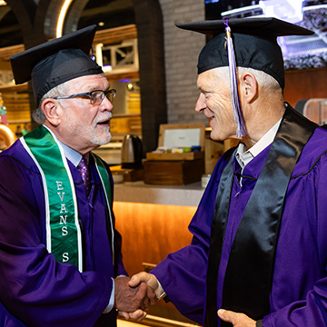 Two alums at commencement celebration